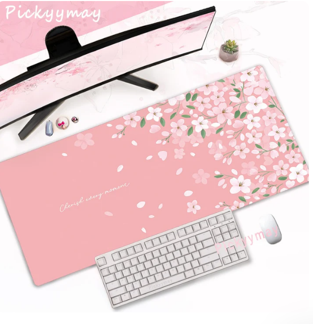 Cherry blossom desk pad in soft pink covering a full study desk surface